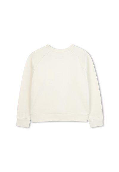 Felpa color crema con texture a coste, maniche raglan e collo arrotondato. L'orlo e i polsini sono rifiniti con cucitura solida.