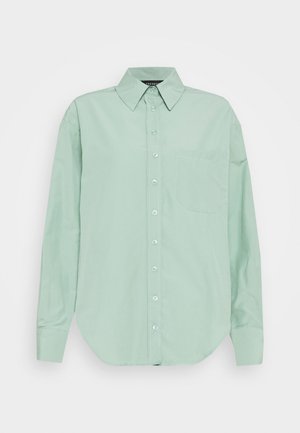 Light green button-up long-sleeve shirt with pointed collar and single chest pocket, displayed on a plain white background.