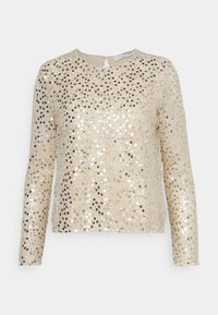 Zlatý flitrový top s dlouhými rukávy, kulatým výstřihem a detailem klíčové dírky na zádech. Má strukturovanou látku s náhodně rozloženými lesklými flitry.