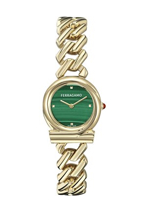 Gold-tone watch with a chunky chain bracelet, featuring a green malachite dial, golden hour markers, and red accent on the crown.