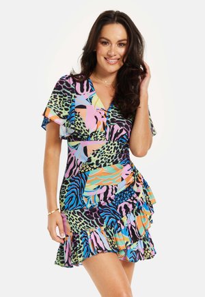 Short dress featuring a vibrant mix of animal and abstract patterns in green, pink, blue, and orange. Lightweight fabric with flared sleeves and ruffles.