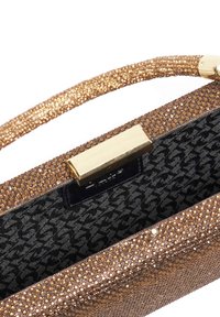 Sparkling bronze handbag with a textured surface, gold hardware, and a black patterned interior featuring houndstooth design.