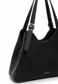 Black leather handbag with a textured surface, rounded shape, two straps, silver hardware accents, and a zipper pocket.