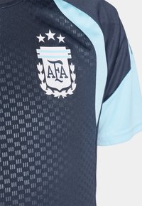 Navy blue sports jersey with light blue accents, featuring a textured pattern, embroidered AFA logo, and three stars above it on the chest.