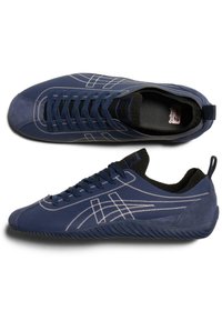 Navy blue sneakers with suede and textile materials. Features white stitching, rubber sole, and a cushioned ankle collar. Low-profile design.
