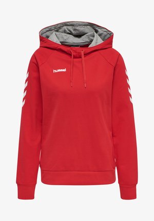 Sweat à capuche rouge avec un intérieur gris, comportant une poche avant, un cordon de serrage et des motifs chevrons blancs sur les manches. Logo Hummel sur la poitrine.