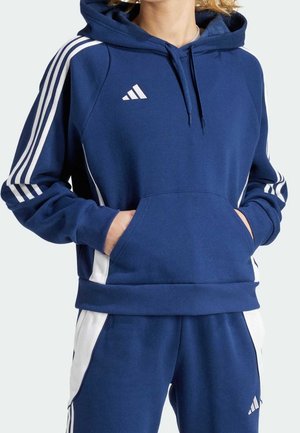 Marineblauwe hoodie met witte zijstrepen, kangaroo zak, trekkoord capuchon en Adidas-logo op de borst. Zacht materiaal, sportief ontwerp.