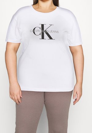 Weißes Baumwoll-T-Shirt mit schwarzem "CK"-Logo und dem Text "CALVIN KLEIN JEANS". Kurze Ärmel, runder Halsausschnitt, lockere Passform.