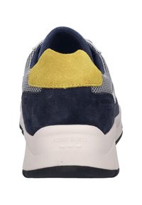 Sport shoe featuring a blue suede heel, yellow suede accent, breathable mesh upper, and a textured white rubber sole with branding.