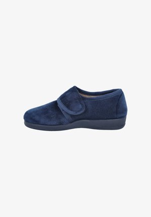 Zapatilla de felpa azul marino con correa ajustable de Velcro y suela de goma negra, diseñada para la comodidad y facilidad.