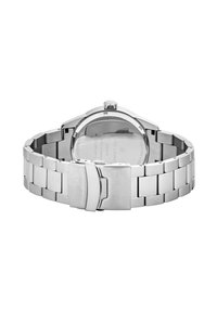 Montre-bracelet en acier inoxydable argenté avec un bracelet brossé et poli, un boîtier rond et un fond de boîtier transparent. Présente une couronne sur le dessus.