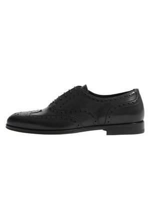 Schwarze Lederdressschuhe mit Brogue-Details, runder Zehenform, fünf Ösen, niedrigem Absatz und glatter Oberfläche. Klassisches Design mit durchbrochenen Akzenten.