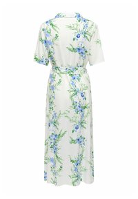 Vestido midi blanco con mangas cortas, estampado de flores azules y hojas verdes, cintura con cinturón y cuello, visto desde atrás.