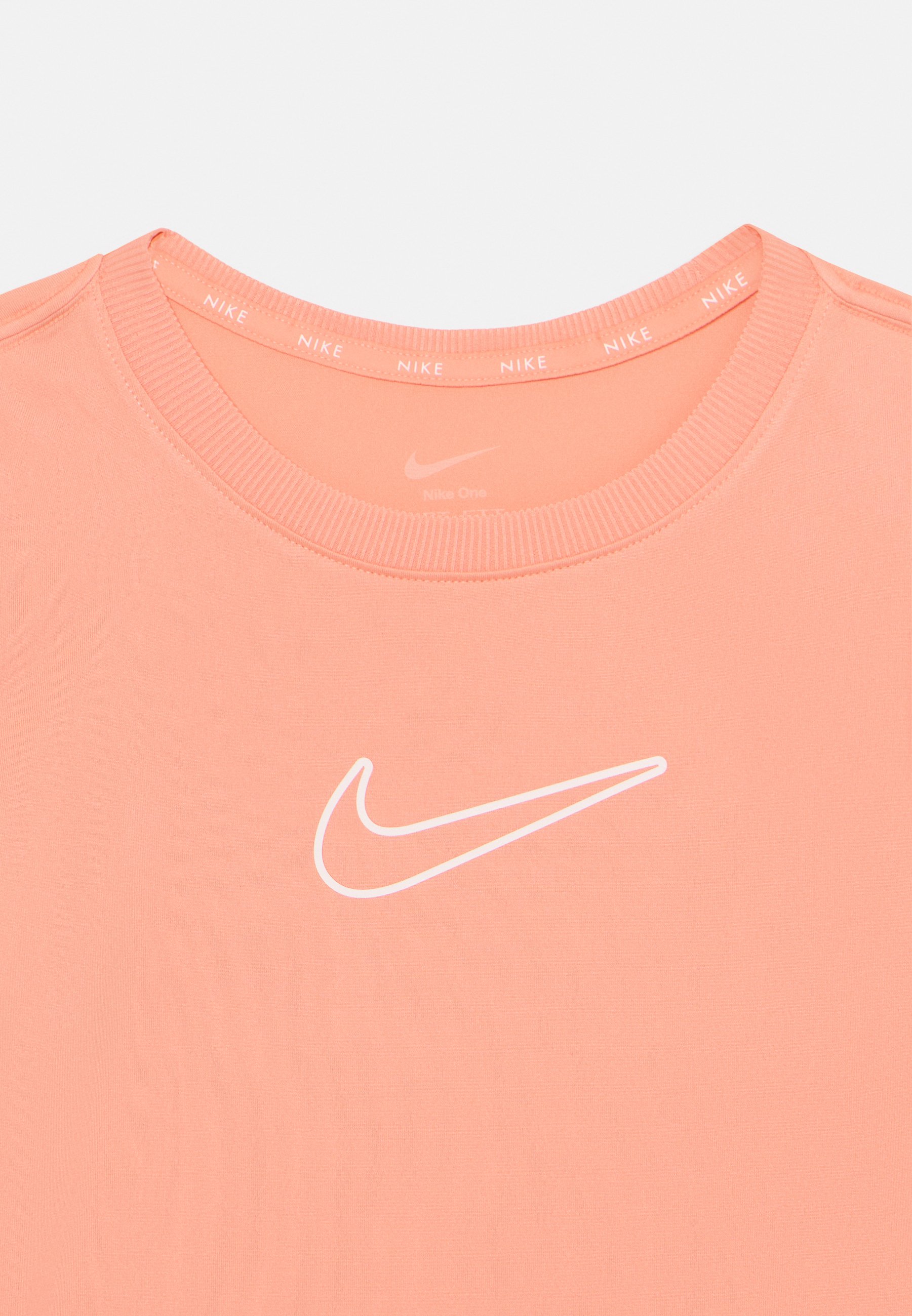 white and peach nike shirt
