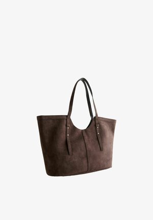Large brown suede tote bag with two thin shoulder straps and visible stitching on a white background.