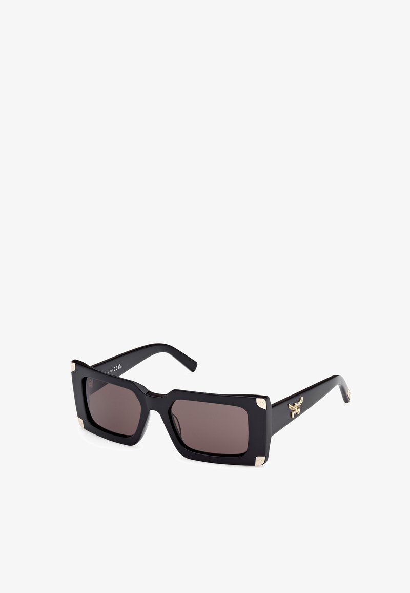 Mustat suorakulmaiset aurinkolasit ruskeilla sävyttävillä linsseillä, kullatut yksityiskohdat kulmissa ja kohokuvioitu merkki sivussa. Valmistettu muovimateriaalista.