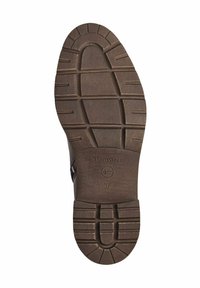 Semelle de chaussure en caoutchouc brun avec une texture antidérapante, présentant des rainures horizontales et verticales, le nom de marque gravé "TOMORIS" et la taille "37".