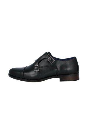 Zapato de vestir para hombre de cuero negro con hebillas dobles tipo monk strap y tacón bajo de madera, mostrado de perfil.