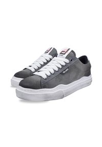 Gray suede sneakers with white laces, featuring a rubber sole and subtle branding on the side. Round toe and low-top design.