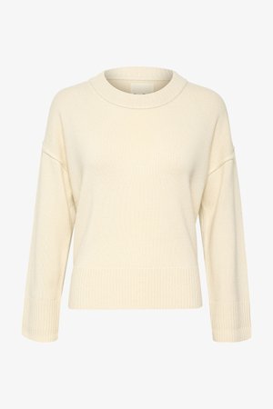 Pulover tricotat de culoare crem, cu guler rotund cu creneluri, umeri căzuți și manșete și tiv crenelate. Textură moale și croială lejeră.