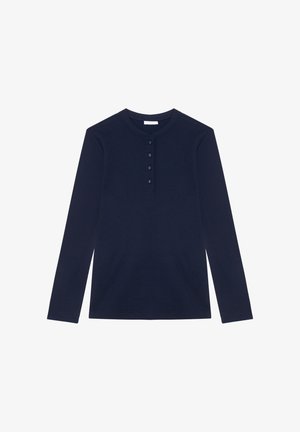 Navy blue long-sleeve waffle knit henley shirt with a round neckline and four buttons down the front placket.