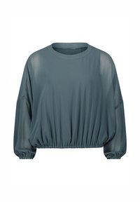 Maglietta a maniche lunghe e vestibilità ampia di un colore teal tenue. Caratterizzata da un collo rotondo, orlo elasticizzato e tessuto trasparente sulle maniche, creando un effetto sovrapposto.