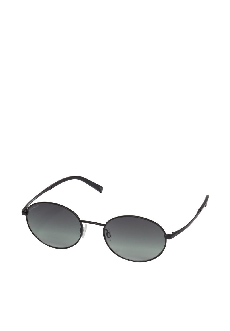 Ovale zonnebril met een zwarte metalen frame, donkere gradient lenzen en slanke pootjes. Voorzien van rubberen neuspads voor comfort.