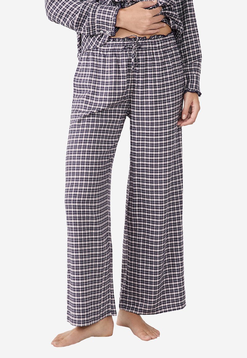 Geruite pyjamabroek in marineblauw en wit, gemaakt van zachte stof, met een losse pasvorm, elastische tailleband en een trekkoordsluiting.