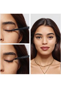 Zwarte eyelinerpotlood aangebracht op het bovenste ooglid van een model met lang, donker haar; close-up, met gladde lijnen en natuurlijke make-up.