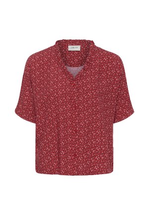 Raudona trumpomis rankovėmis marškiniai su mažais baltais ir juodais gėlių raštais bei laisvo, nevaržomo kirpimo.