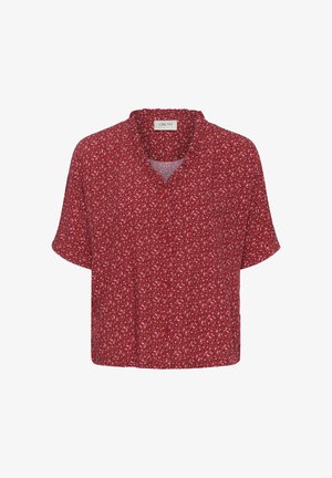 Piros, rövidujjú, gombos ing, apró fehér és fekete virágmintával, laza, kényelmes szabással.