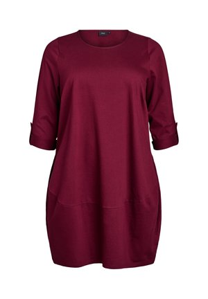 Burgundy tunic top made of soft fabric, featuring a round neckline, three-quarter sleeves, and two front pockets with a relaxed fit.