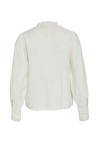 Balti, ilgomis rankovėmis marškiniai su aukšta apykakle ir raukiniais, rankovėse klostės ir sudėtinga nėrinių apdaila rankogaliuose.