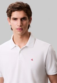 Calvin Klein Jeans Polo shirt - blanc de blanc