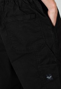 Reell REFLEX HUSTLER - Stoffhose - black canvas