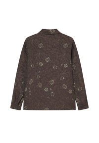 Tumepruun pikka varrukaga särk lillemustriga. Omab kraed, nööbitega mansette ning sirget lõiget.