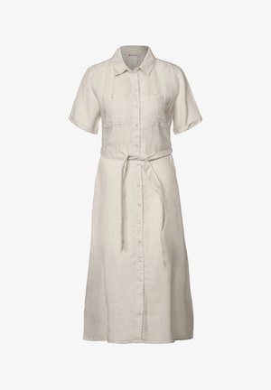 Robe à manches courtes et boutonnée en lin beige clair, dotée de deux poches poitrine et d'une taille ceinturée. Silhouette droite avec une longueur au genou.