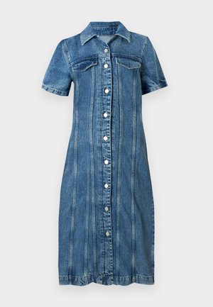 Denim dress featuring short sleeves, front button closure, two chest pockets, and a knee-length cut with vertical seams.