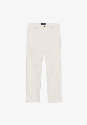 Heledates toonis puuvillased teksad sirge säärega, ees lukustuvate nööpide ja viie taskuga. Sile tekstuur, nähtamatute mustriteta.