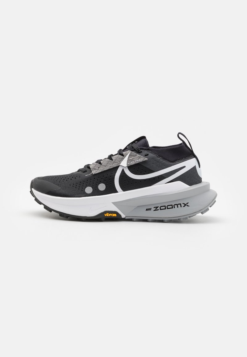 Black running shoe with a mesh upper, reflective accents, and a white midsole. Features Vibram outsole and ZoomX cushioning technology.
