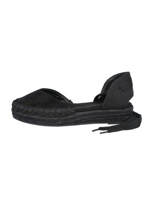Sandalia espadrille negra con puntera cerrada, suela entretejida, lazos para atar en el tobillo y contrafuerte texturizado, sobre un fondo blanco.