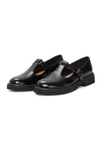 Zwarte gepatineerde lederen schoenen met een Mary Jane ontwerp, een gespstrap, ronde neus en een dikke, gestructureerde rubberen zool.