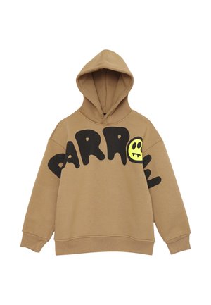 Felpa marrone con un ampio design di testo nero e una grafica di un sorriso giallo. Realizzata in materiale morbido, ha una vestibilità comoda e una tasca a marsupio.