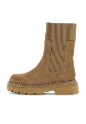 Stivaletto in suede marrone con tomaia in tessuto a coste, suola in gomma spessa e cuciture visibili lungo la suola intermedia. Design chunky e casual.