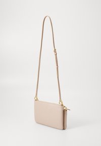Beige leather crossbody bag with smooth texture, gold-tone hardware, and adjustable strap. Slim, rectangular design. Minimal branding details.