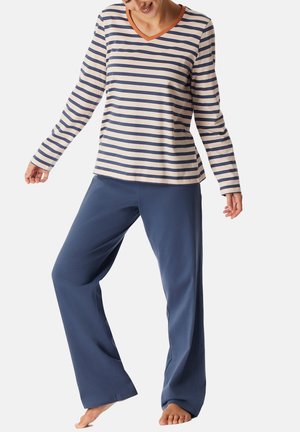 Randig långärmad topp i creme och marinblå med v-ringning och orange detaljer, matchad med lösa marina byxor. Mjuk tygkvalitet och avslappnad passform.