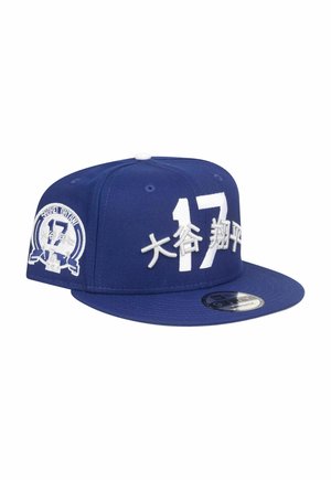 Blue snapback cap with white embroidered text "17" and symbols. Features a structured body, flat brim, and adjustable strap.
