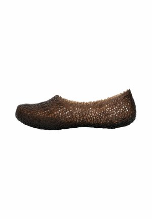 Brown woven flat shoe with a rounded toe and low-cut sides, made from a flexible, lattice-patterned material.