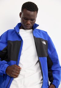 The North Face EASY WIND TRACK JACKET - Suvejakk - blue/black