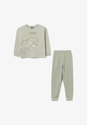 Set di pigiama verde composto da una maglietta a maniche lunghe con una grafica di dinosauro e il testo "Troppo assonnato per svegliarsi", abbinato a pantaloni a quadretti.
